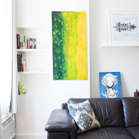 Pour yourself a glass of wine and sprawl out on the leather sofa