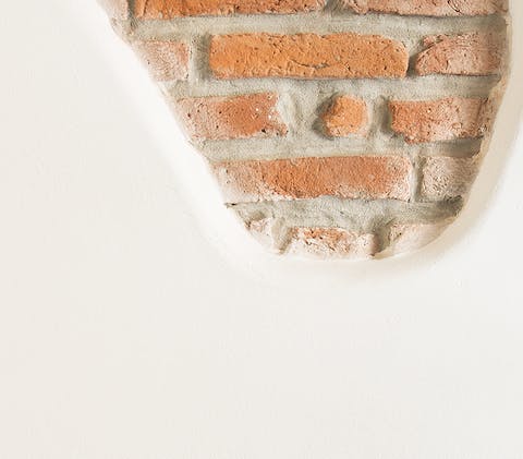 Admire decor touches like exposed brickwork