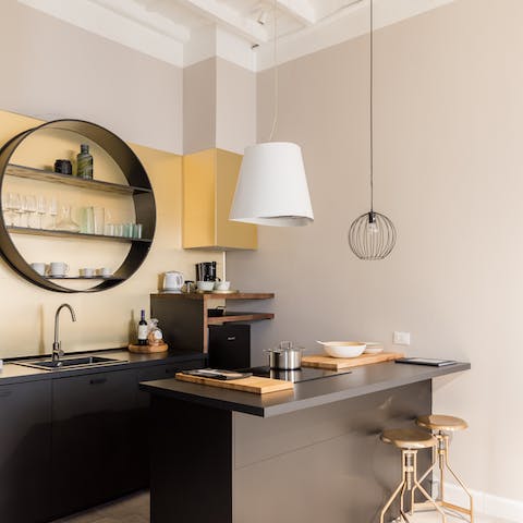 Spark your culinary creativity in the stylish kitchen, with its monolithic minimalist design