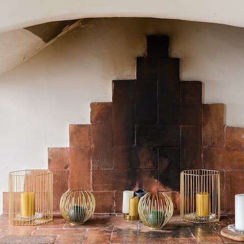 Spend cosy evenings by the fireplace – light atmospheric candles or set a log fire to warm up on winter evenings