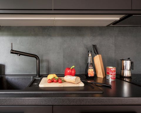 The sleek black kitchen
