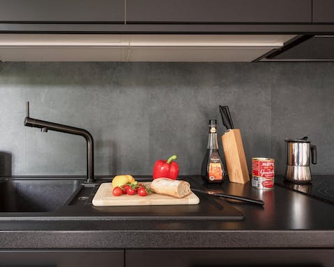 The sleek black kitchen