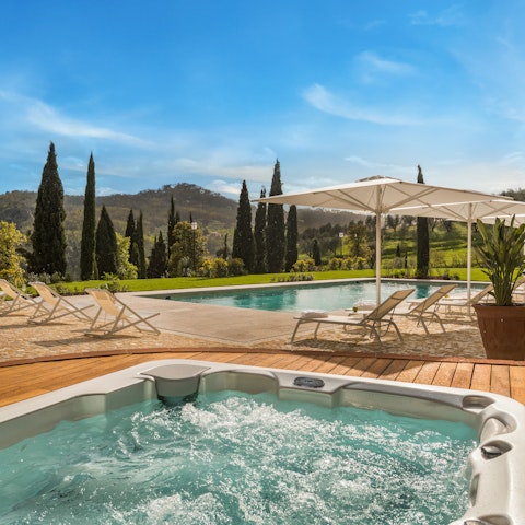 Unwind in the jacuzzi and admire the stunning mountain scenery