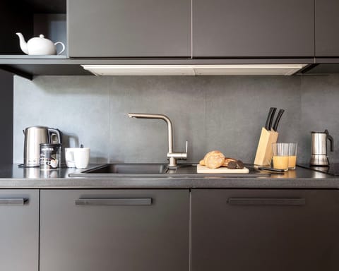 The sleek matte black kitchen
