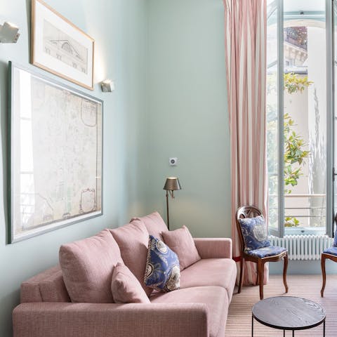 Enjoy a glass of French wine on the sofa after exploring the City of Light