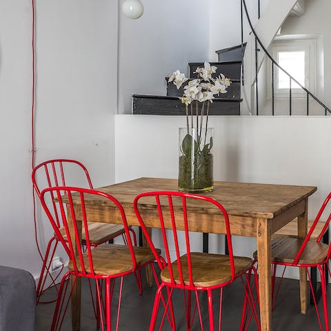 Start mornings with fresh coffee and croissants at the rustic wooden dining table
