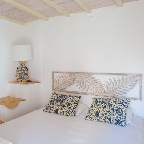 The hand-carved bedframes