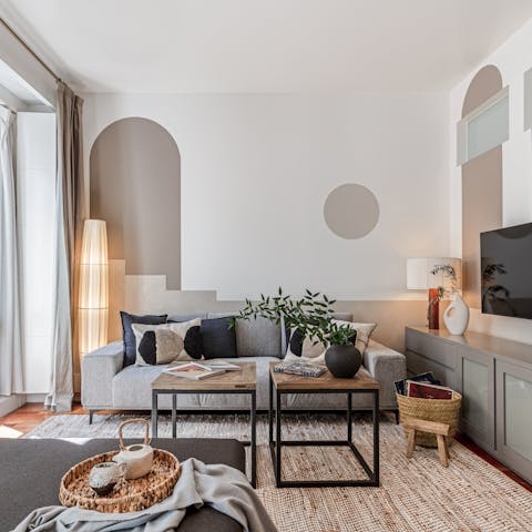 Kick back in the bright living room with a glass of Spanish wine and one of the books from the shelves