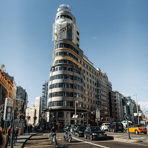Admire Gran Vía's striking architecture, a fifteen-minute walk away