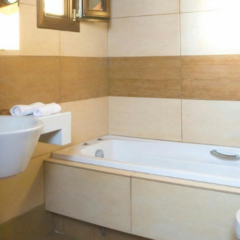 Close your eyes and sink back into one of the pair of Jacuzzi bathtubs