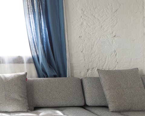 The white-painted brick wall