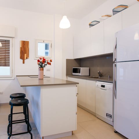 Rustle up a delicious home-cooked meal in the sleek kitchen for a quiet night in
