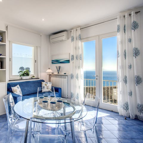 Open the doors and feel the sea breeze dancing through the living room