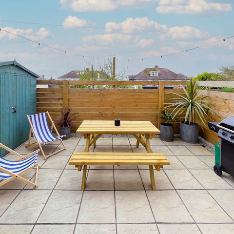 Gather together for an alfresco barbecue feast on the private patio