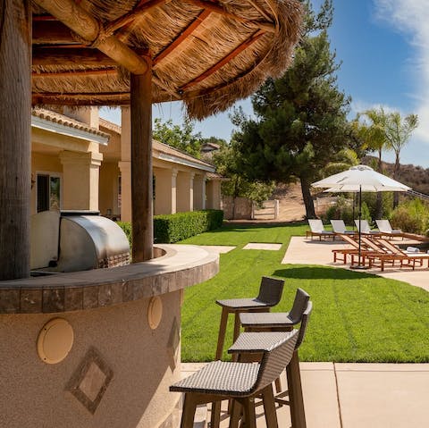 Take a breather at the outside bar area ahead of firing up the barbecue