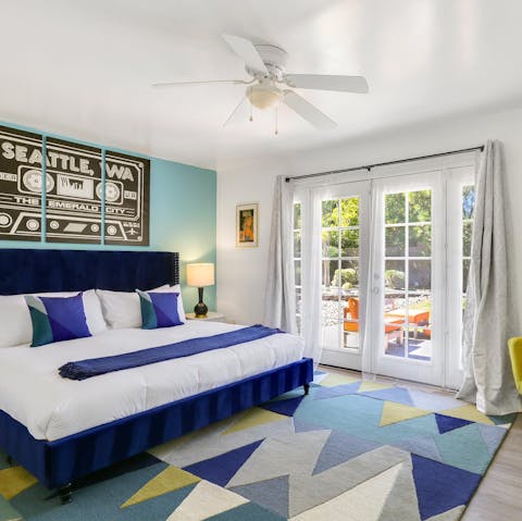 Access the outdoors by throwing the master bedroom's doors open