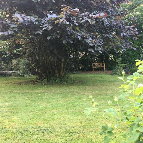 Pass unseasonably warm afternoons in the home's large garden