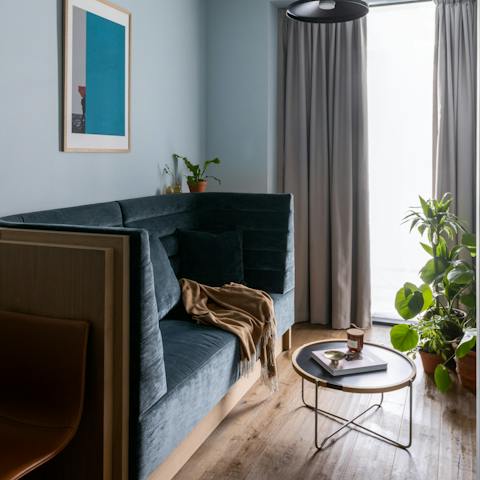 Spend evenings curled up on the plush velvet sofa