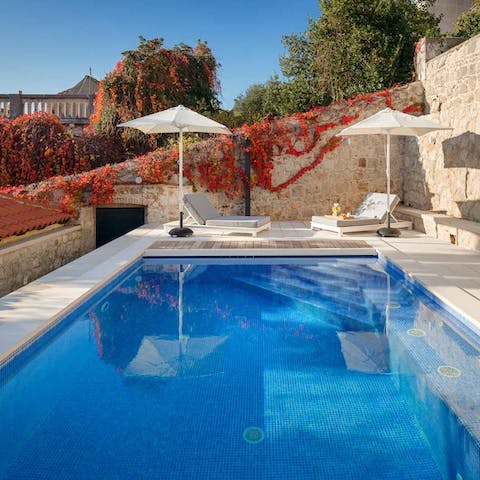 Swim in your private pool and drip dry on the sun loungers