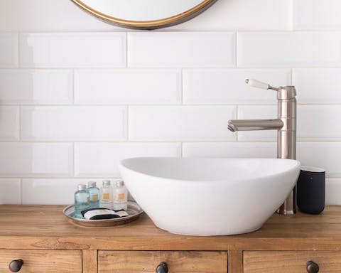 Glossy metro tiling in both bathrooms