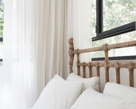 The wooden bed frame with handcarved details