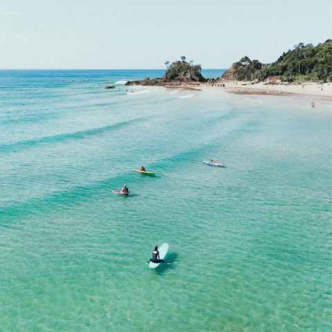 Take a five-minute drive to Byron Bay and go surfing