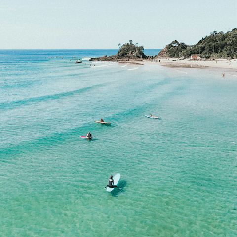 Take a five-minute drive to Byron Bay and go surfing