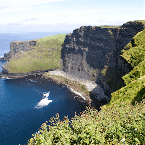 Explore the rolling countryside and craggy Atlantic coastline of County Clare