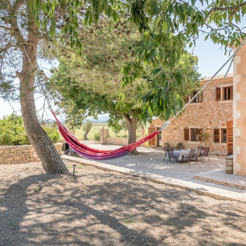 Relax in the hammock under the shade of the trees
