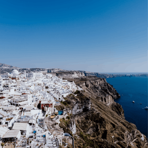 Sample the bars and restaurants of Fira, a few metres away