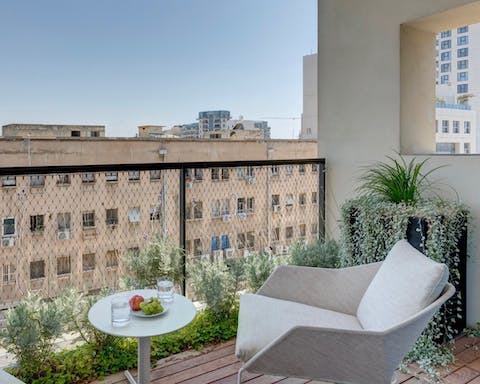 Read a book surrounded by plants on your private balcony