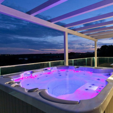 Indulge in a starlit soak in the hot tub