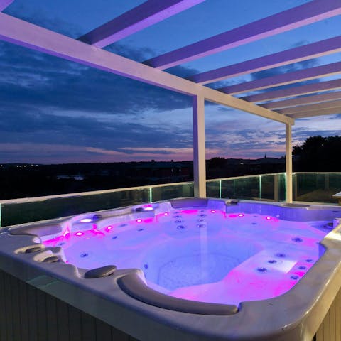 Indulge in a starlit soak in the hot tub