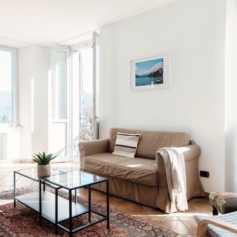 Relax on the sofa in the main bedroom after enjoying a hike