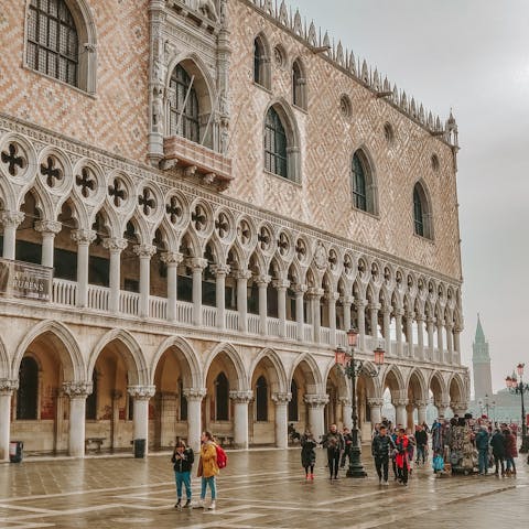 View the architecture of the iconic Doge's Palace – a short walk away