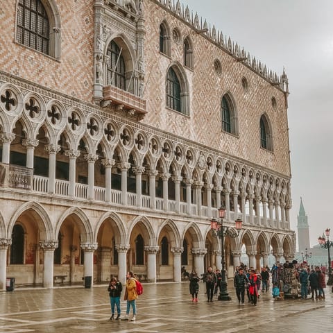 View the architecture of the iconic Doge's Palace – a short walk away