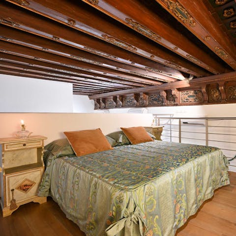 Relax in your cosy bedroom, and admire the original carved beams