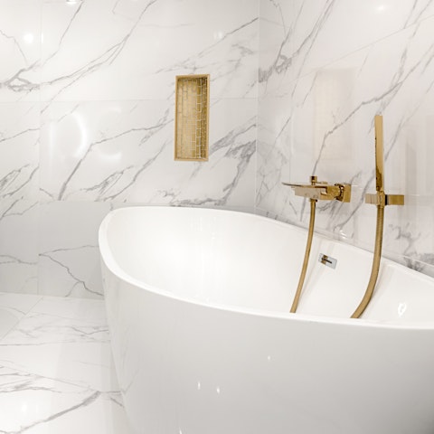 Slip into the freestanding bath after a long day on your feet