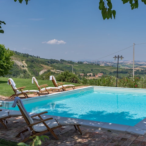 Unwind and enjoy the scenery from one of the sun loungers by the pool