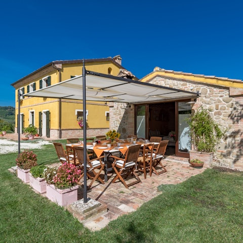 Share festive alfresco meals under the shady canopy