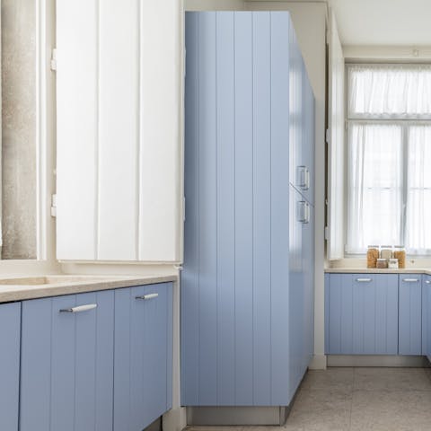 The cornflower-blue kitchen cabinets