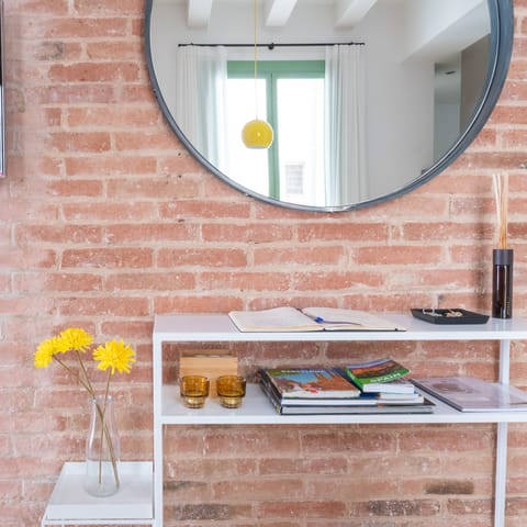 Take in the home's rustic features and exposed brick wall