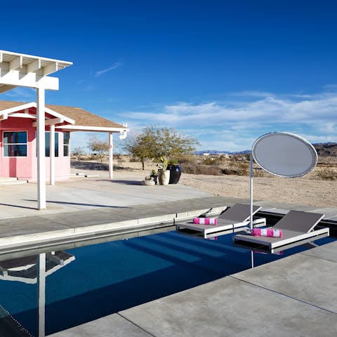 Cool down from the desert heat by slipping into the private pool