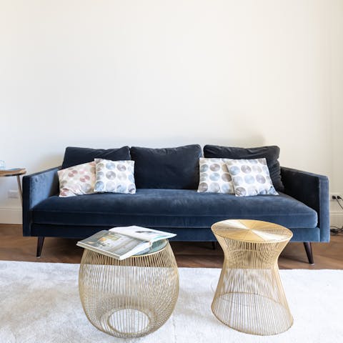 Sink into the navy velvet sofa after a day wandering Rome