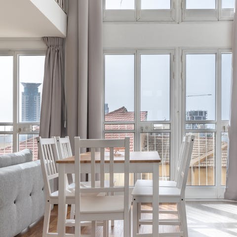 Gaze out across the rooftops from the wall of windows