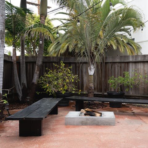 An outdoor fire pit and seating area