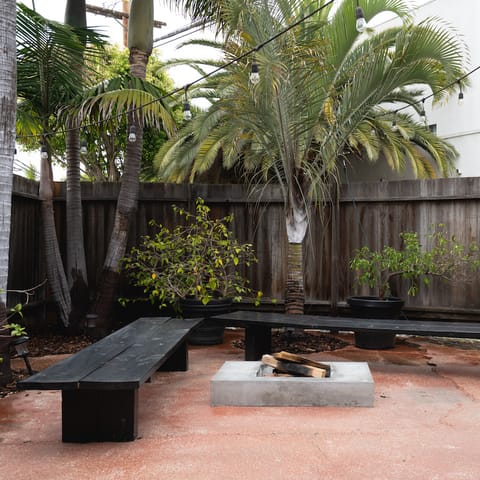 An outdoor fire pit and seating area