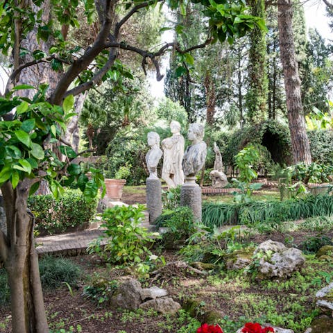 Statues springing up through the leaves