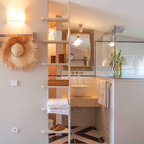 Start mornings with a luxurious soak under the rainfall shower