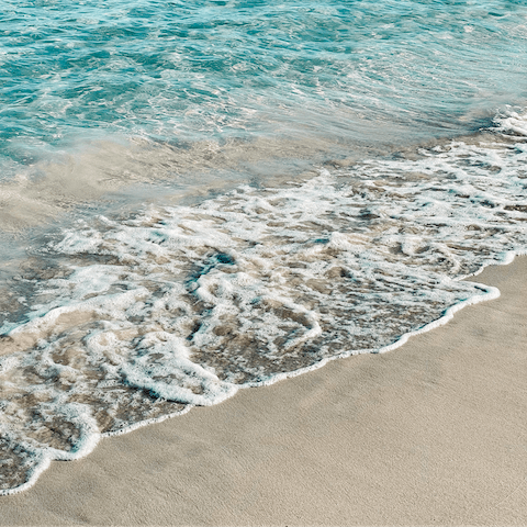 Sink your toes in the sand at Playa S'Arenal, seventeen minutes away by car